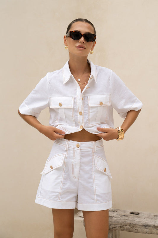 Image of a model wearing Shorts. Productname: HEYCHIC Averie White Tailored Shorts in White colour by brand - HEYCHIC