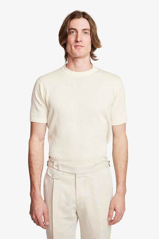 Image of a model wearing Tops. Productname: Anthony Squires Braided Knit Tee - Cream in Cream colour by brand - Anthony Squires