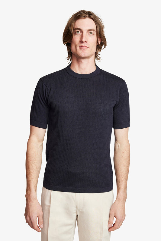 Image of a model wearing Tops. Product name - Braided Knit Tee Navy Blue in Blue colour by brand - Anthony Squires