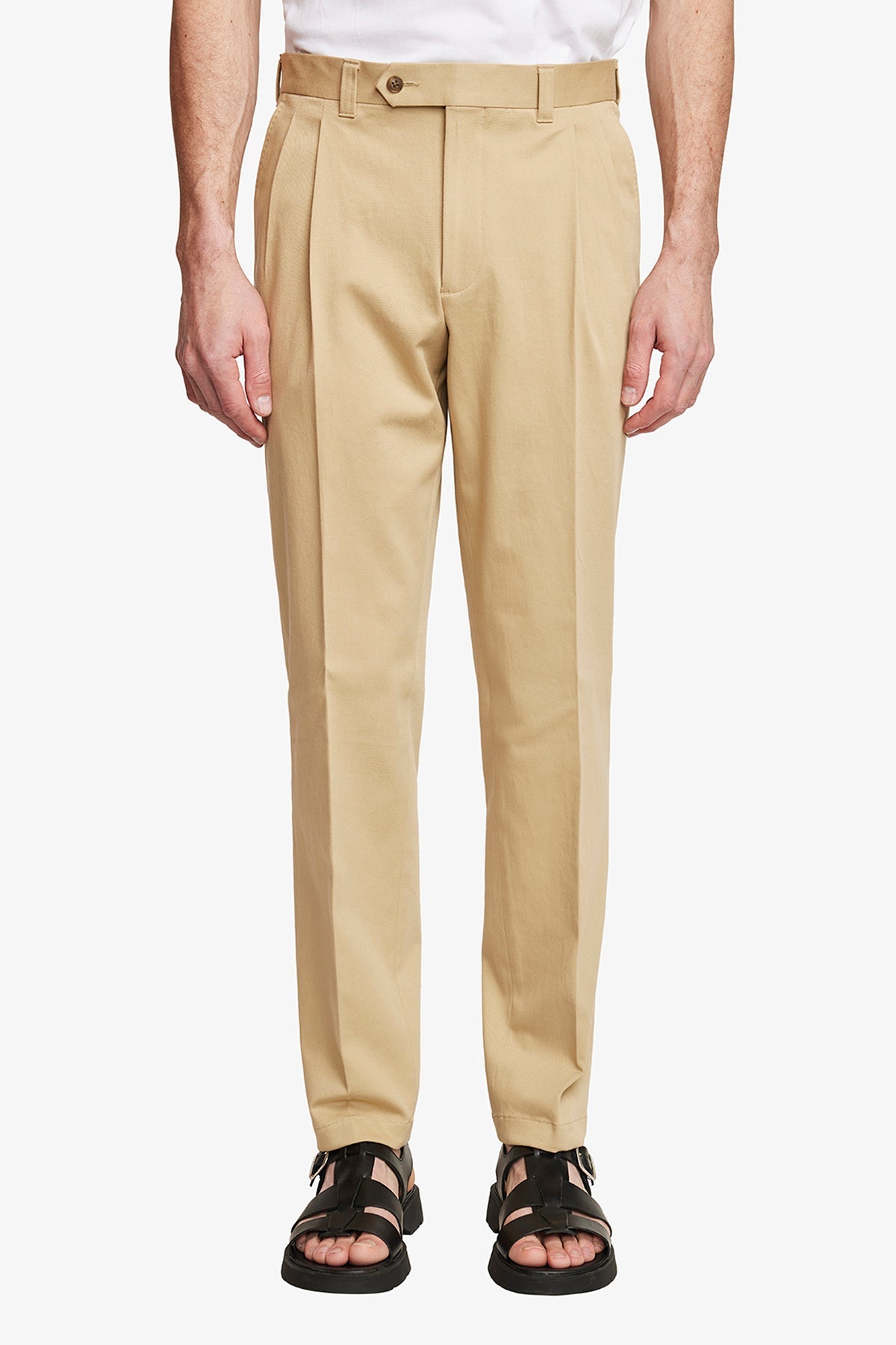 Image of a model wearing Pants. Product name - Dakota Beige in Beige colour by brand - Anthony Squires