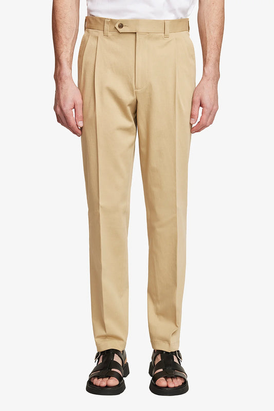 Image of a model wearing Pants. Product name - Dakota Beige in Beige colour by brand - Anthony Squires