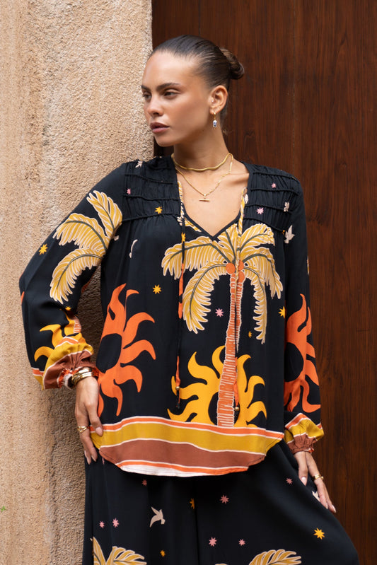 Image of a model wearing Tops. Productname: Heychic Solianne Tropical Long Sleeve Blouse in Black colour by brand - Heychic