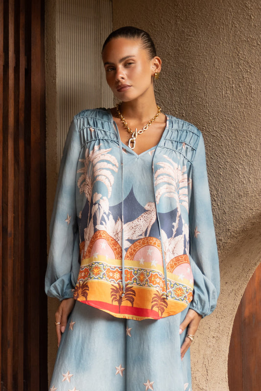 Image of a model wearing Tops. Productname: Heychic Amalita Tropical Long Sleeve Blouse in Blue colour by brand - Heychic