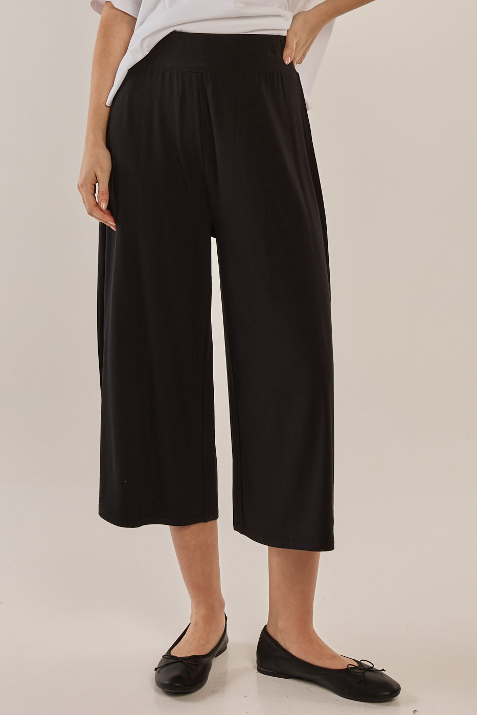 Image of a model wearing Pants. Productname: Betty Basics Crystal Crop Jogger in Black colour by brand - Betty Basics