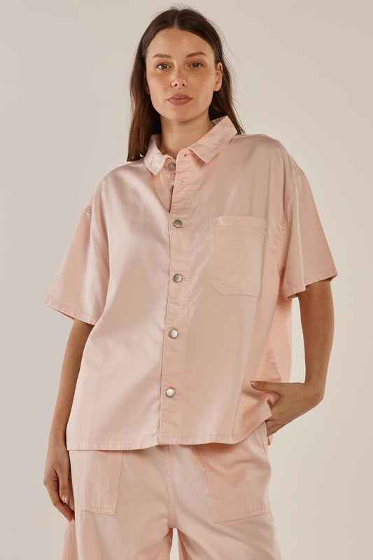 Image of a model wearing Tops. Productname: Betty Basics Saffra Short Sleeve Denim Shirt Pink in Pink colour by brand - Betty Basics
