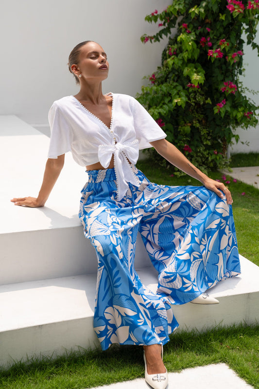 Image of a model wearing Pants. Productname: Heychic Vale Tropical Wide Leg Cropped Pants in Blue colour by brand - Heychic