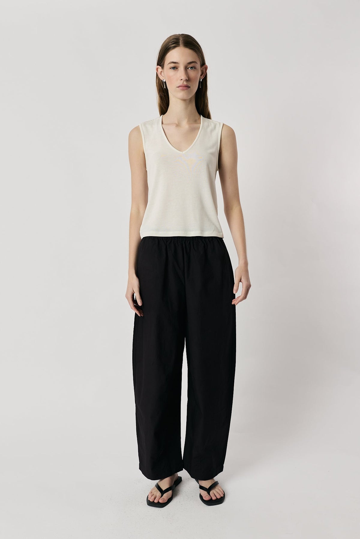 Image of a model wearing Pants. Product name - Giliann Agnes Pant Black Coffee in Black colour by brand - Giliann