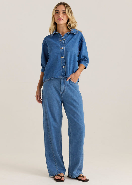 Image of a model wearing Pants. Product name - Nuala Wide Leg Jean Classic Blue Wash in Classic Blue Wash colour by brand - Sass Clothing