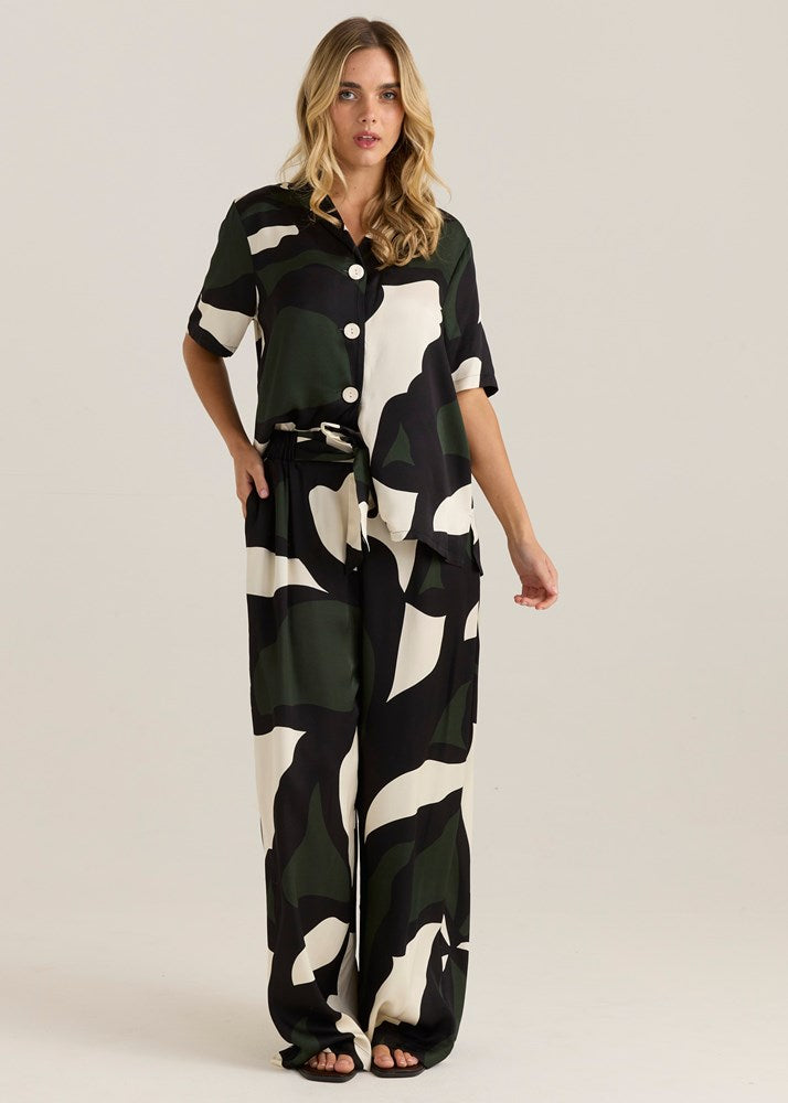Image of a model wearing Pants. Product name - Tarni Satin Pant Iris Abstract Print in Iris Abstract Print colour by brand - Sass Clothing