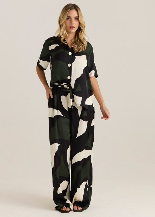 Image of a model wearing Pants. Product name - Tarni Satin Pant Iris Abstract Print in Iris Abstract Print colour by brand - Sass Clothing