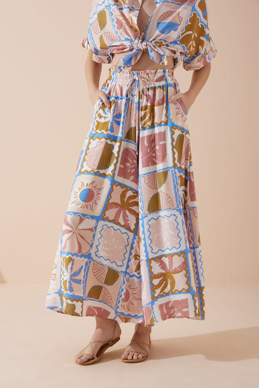 Image of a model wearing Pants. Productname: Heychic Ismerie Tropical Wide Leg Cropped Pants in Pink colour by brand - Heychic