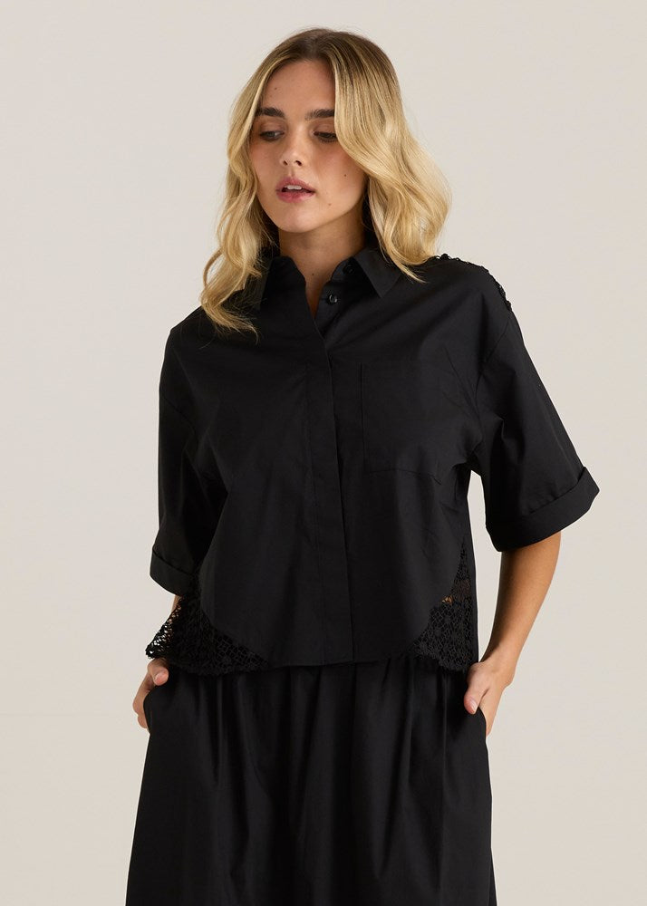 Image of a model wearing Tops. Product name - Nixie Lace Shirt Black in Black colour by brand - Sass Clothing