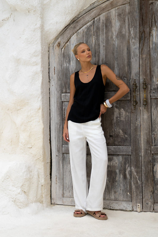 Image of a model wearing Shorts. Productname: HEYCHIC Cairo White Linen Blend Pants in White colour by brand - HEYCHIC