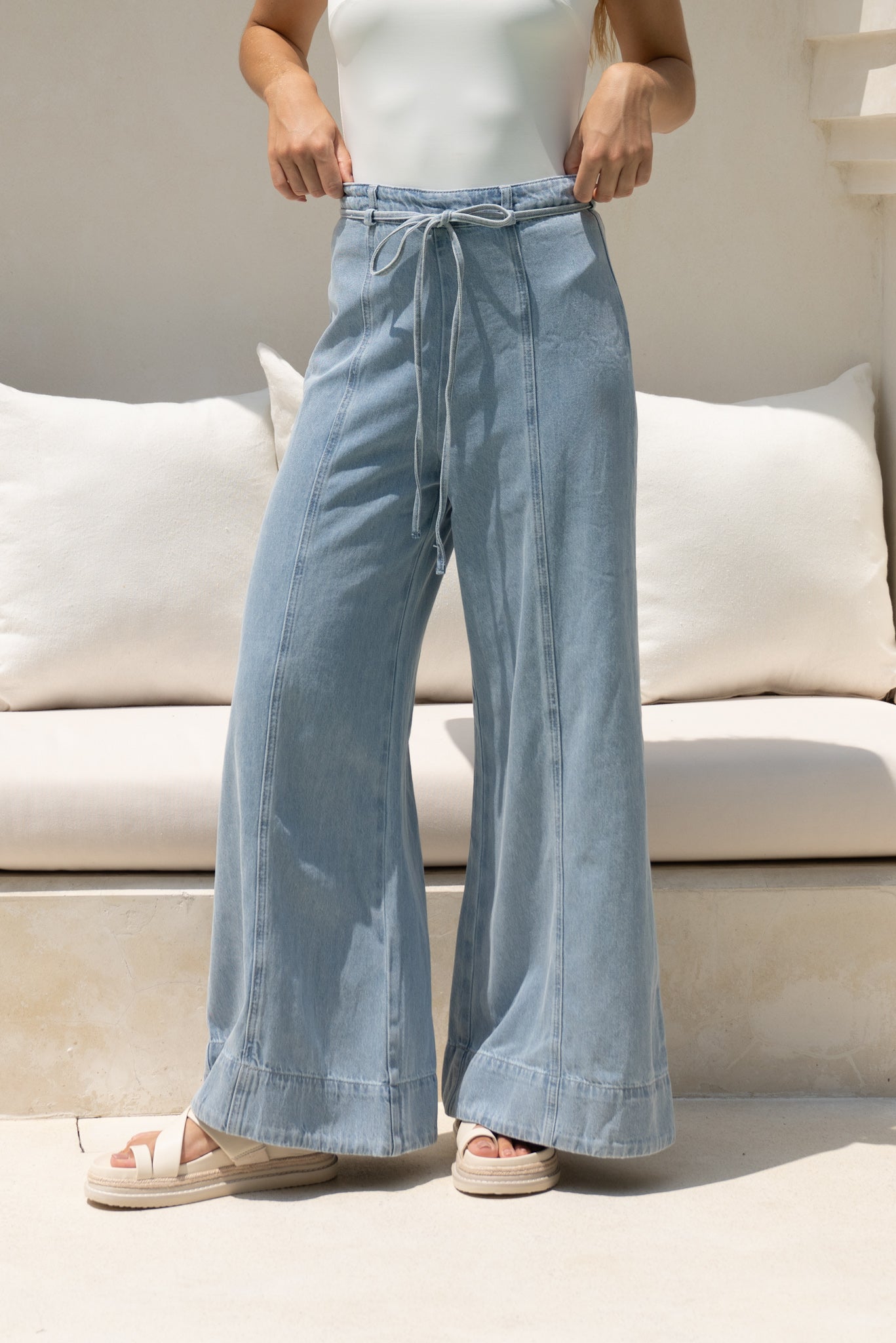 Image of a model wearing Shorts. Productname: HEYCHIC Monty Blue Denim Wide Leg Jeans in Blue colour by brand - HEYCHIC