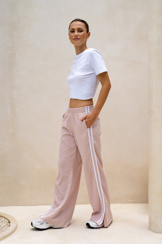 Image of a model wearing Shorts. Productname: HEYCHIC Leah Pink White Contrast Stripe Trackpants in Pink colour by brand - HEYCHIC
