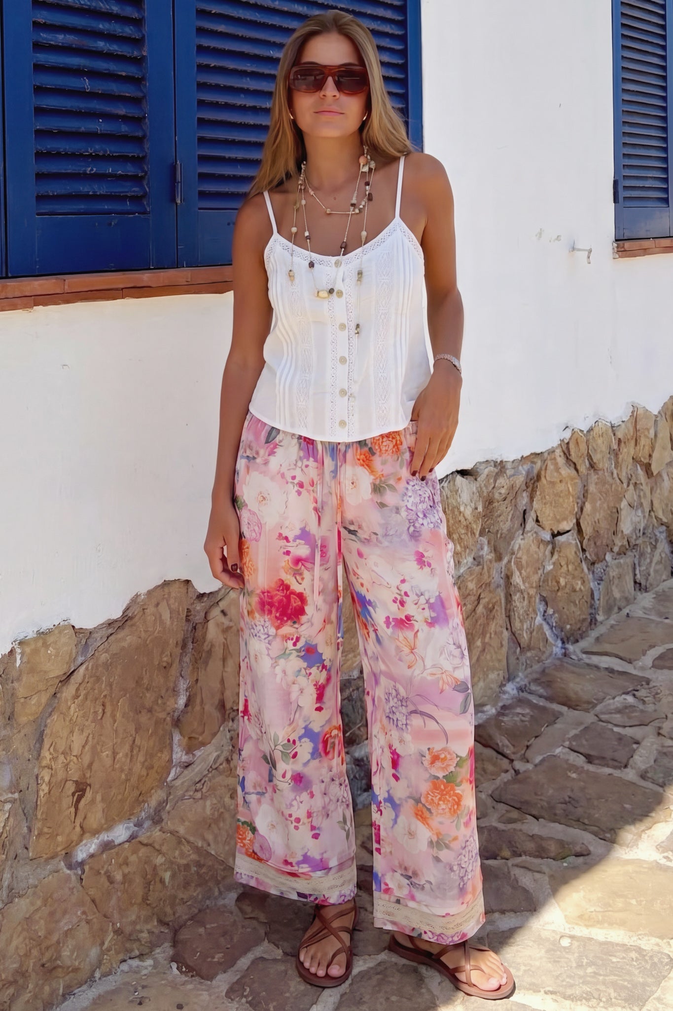 Image of a model wearing Pants. Product name - Elani Pink Floral Pants in Floral colour by brand - HEYCHIC