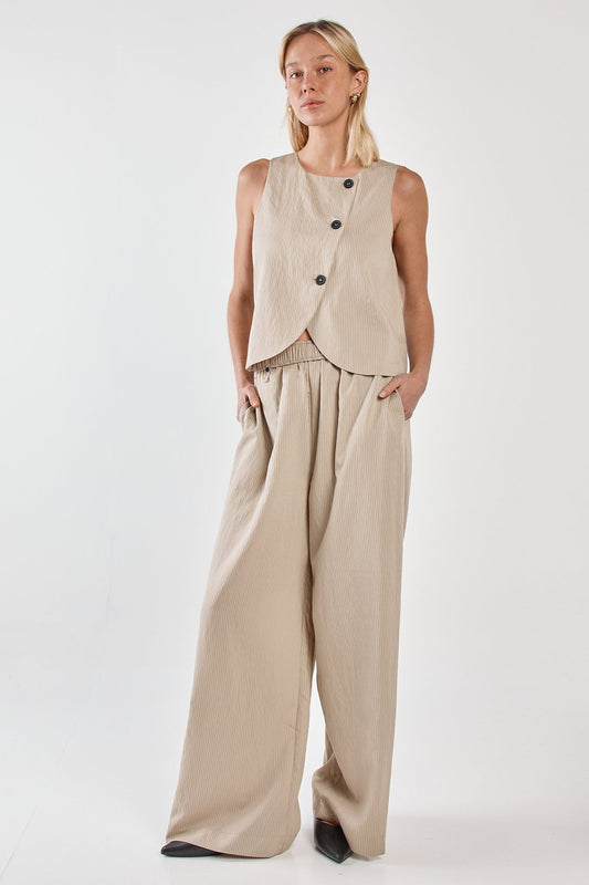 Image of a model wearing Pants. Product name - Renee Paper Bag Pant Beige Black Stripe in Beige Black Stripe colour by brand - Sass Clothing