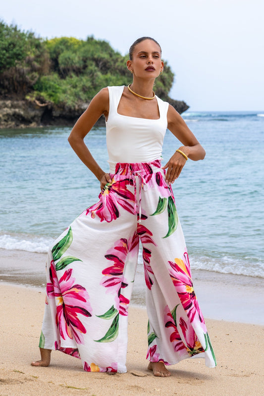 Image of a model wearing Pants. Productname: Heychic Gracie Floral Wide Leg Pants in Pink colour by brand - Heychic