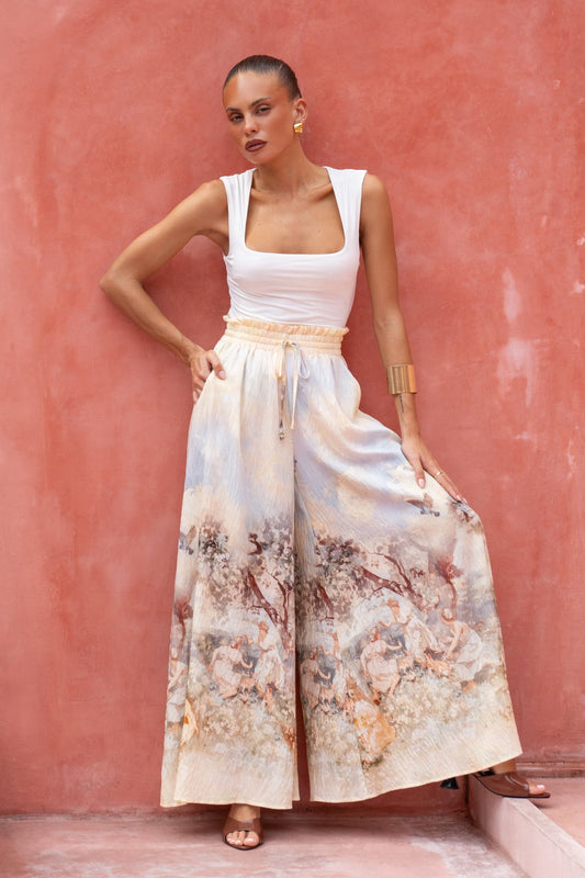 Image of a model wearing Skirts. Productname: Heychic Lavinia Yellow Blue Abstract Wide Leg Pants in Blue colour by brand - Heychic