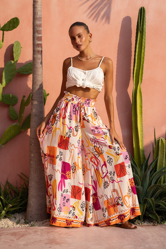 Image of a model wearing Pants. Productname: Heychic Saffron Abstract Wide Leg Pants in Orange colour by brand - Heychic