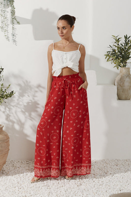 Image of a model wearing Pants. Productname: Heychic Elowen Boho Wide Leg Pants in Red colour by brand - Heychic