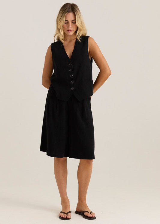 Image of a model wearing Shorts. Product name - Ebba Bermuda Short Black in Black colour by brand - Sass Clothing
