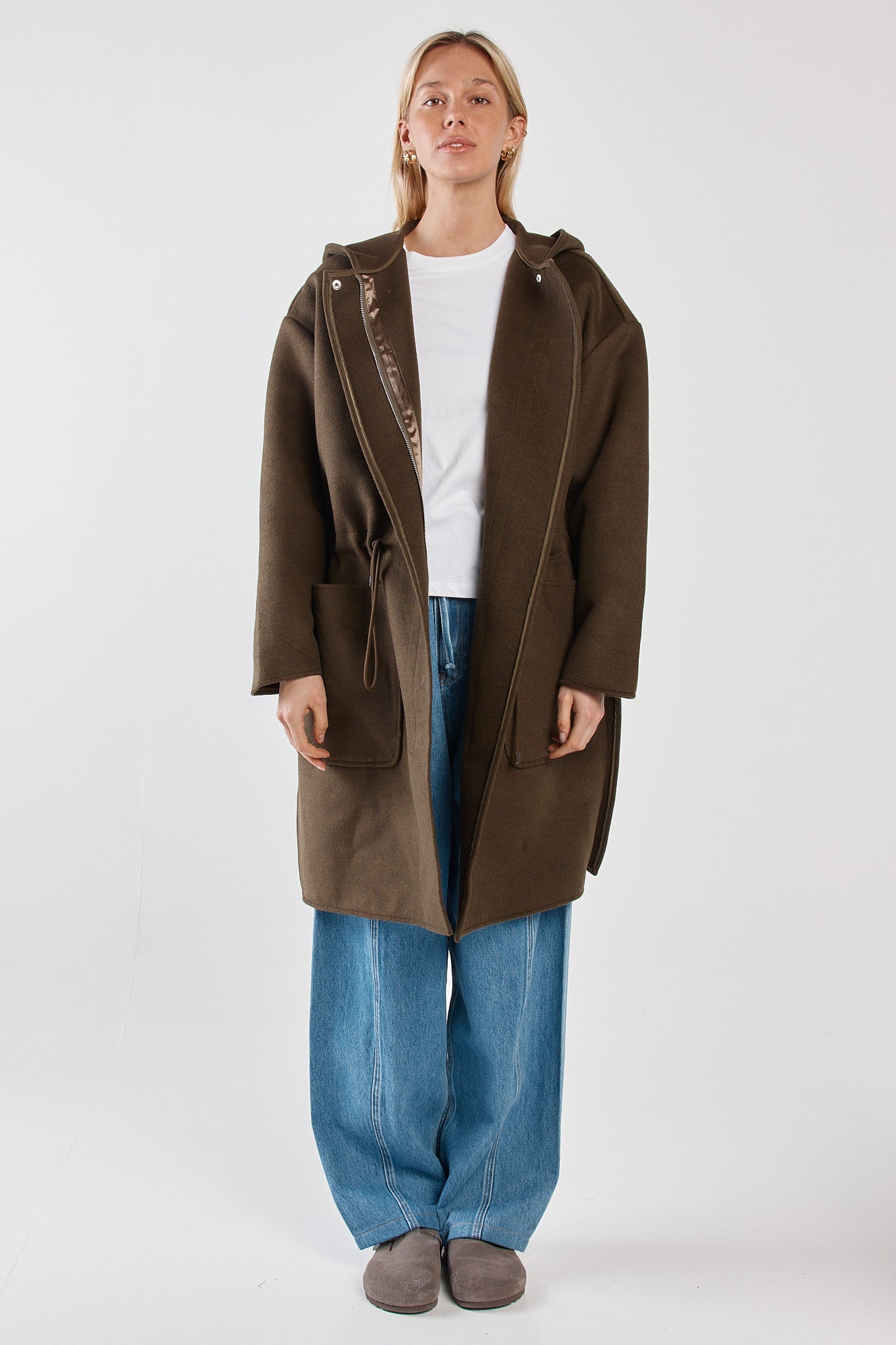 Image of a model wearing Outerwear. Product name - Maxi Hooded Coat Dark Olive in Dark Olive colour by brand - Sass Clothing