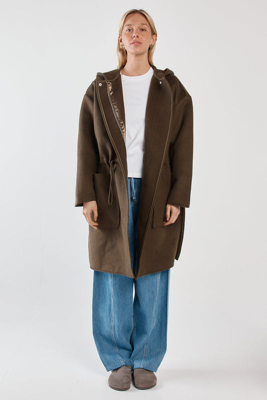 Image of a model wearing Outerwear. Product name - Maxi Hooded Coat Dark Olive in Dark Olive colour by brand - Sass Clothing