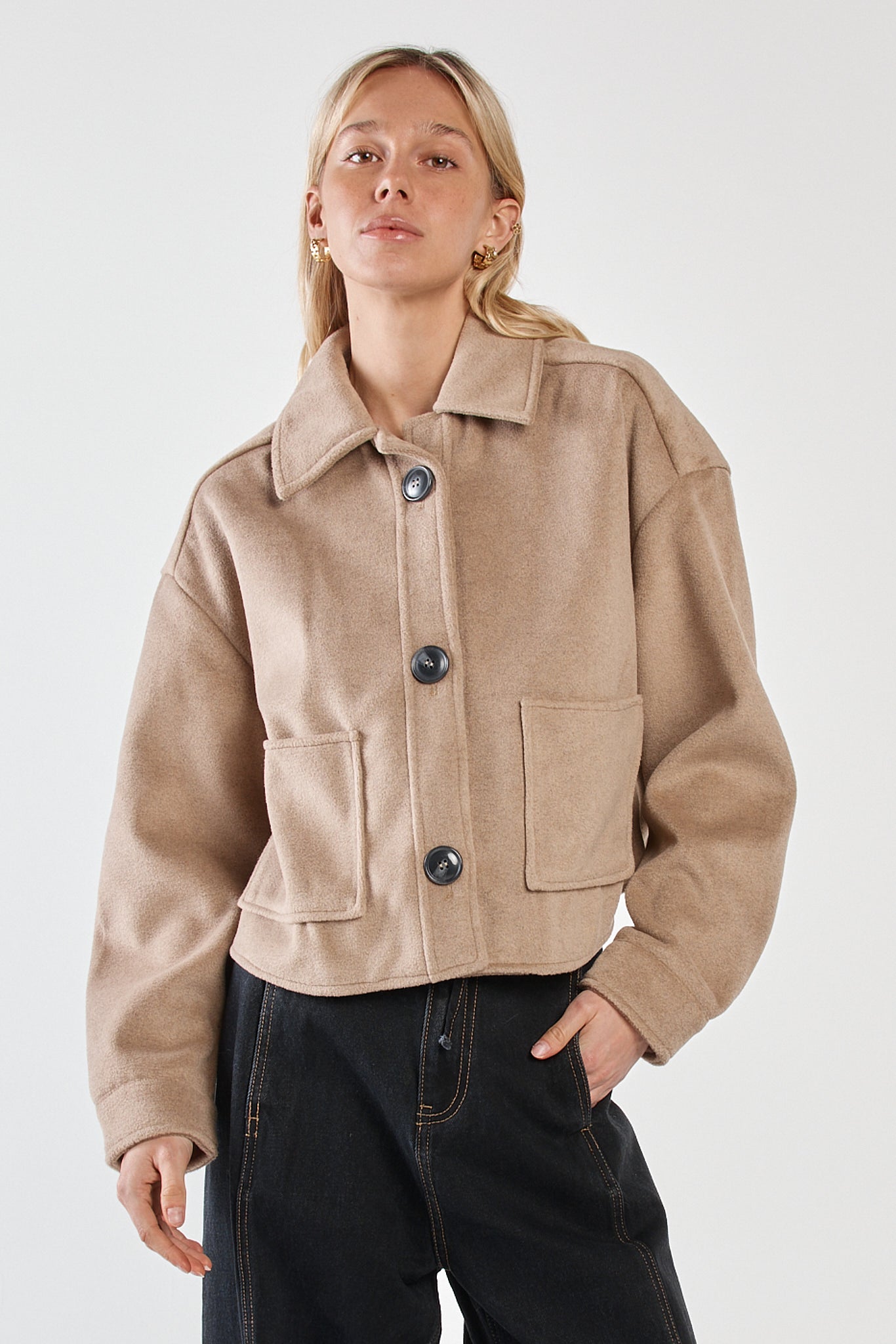 Image of a model wearing Outerwear. Product name - Rochelle Cropped Coat Mushroom Grey in Mushroom Grey colour by brand - Sass Clothing