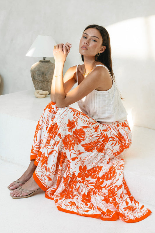 Image of a model wearing Pants. Productname: Heychic Chiara Tropical Maxi Skirt in Orange colour by brand - Heychic