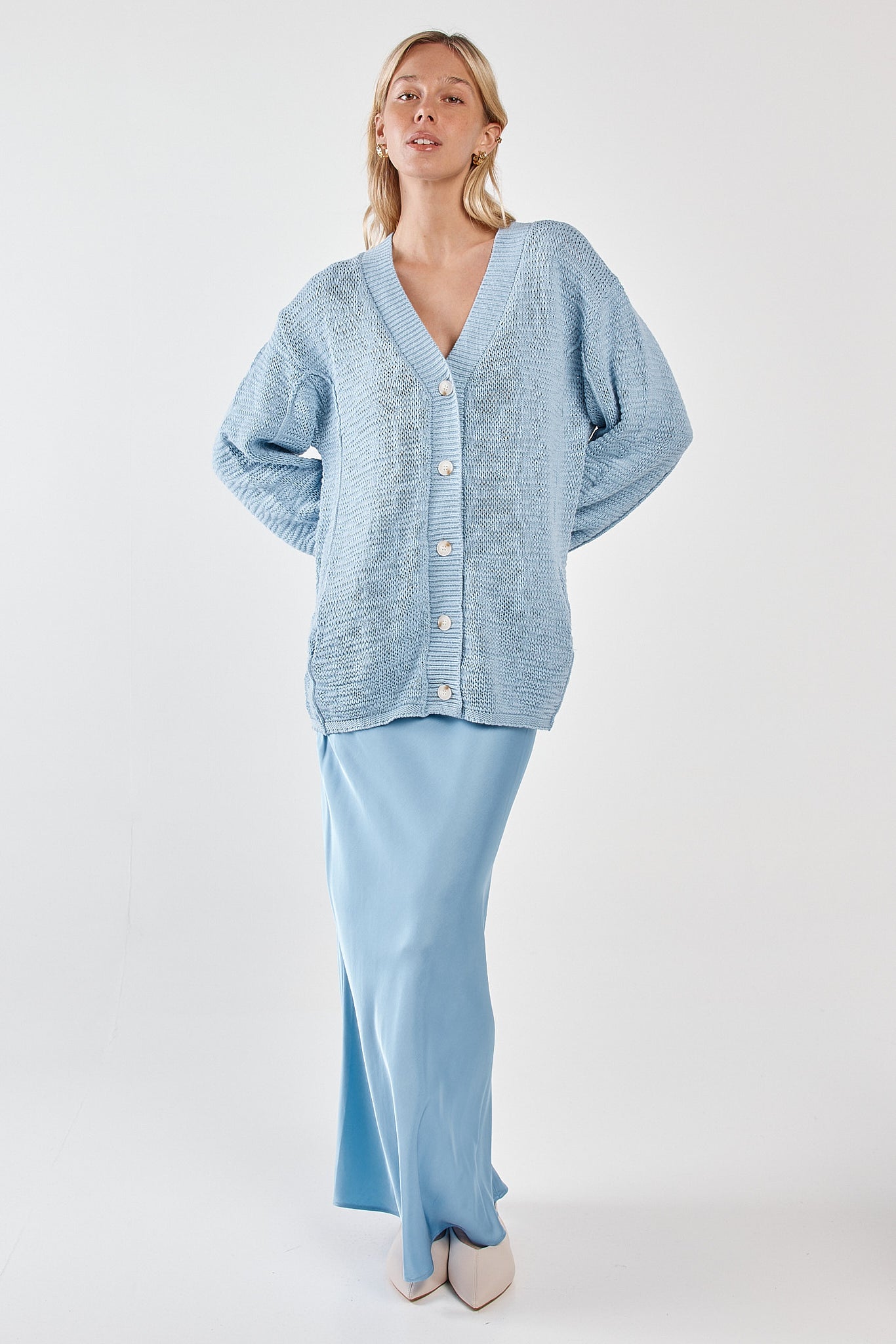 Image of a model wearing Skirts. Product name - Paula Satin Slip Skirt Ice Blue in Ice Blue colour by brand - Sass Clothing