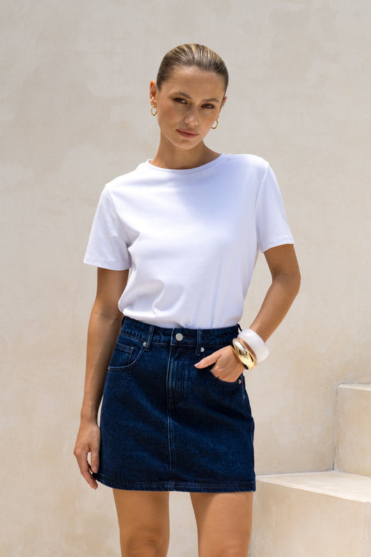 Image of a model wearing Shorts. Productname: HEYCHIC Eris Dark Blue Denim Mini Skirt in Blue colour by brand - HEYCHIC