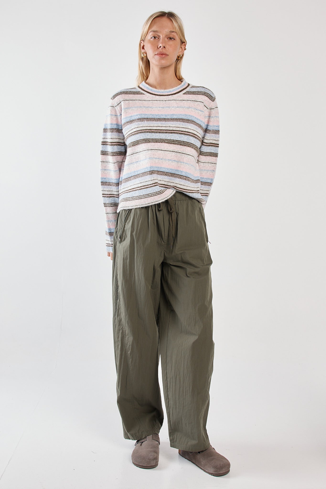 Image of a model wearing Pants. Product name - Reign Barrel Leg Cargo Olive in Olive colour by brand - Sass Clothing