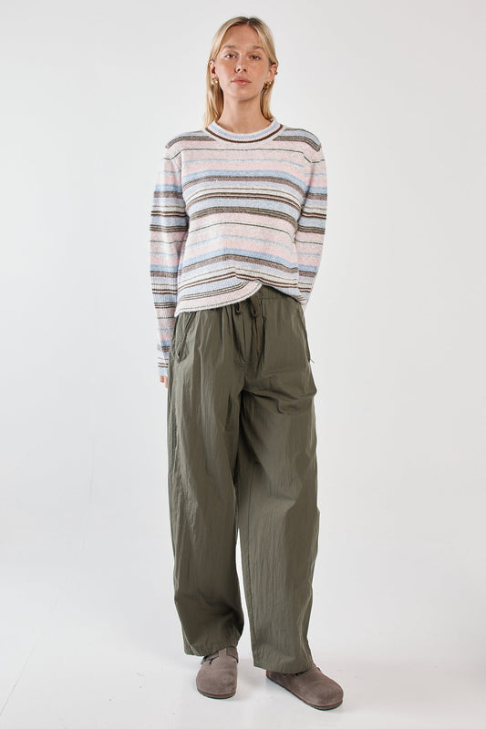 Image of a model wearing Pants. Product name - Reign Barrel Leg Cargo Olive in Olive colour by brand - Sass Clothing