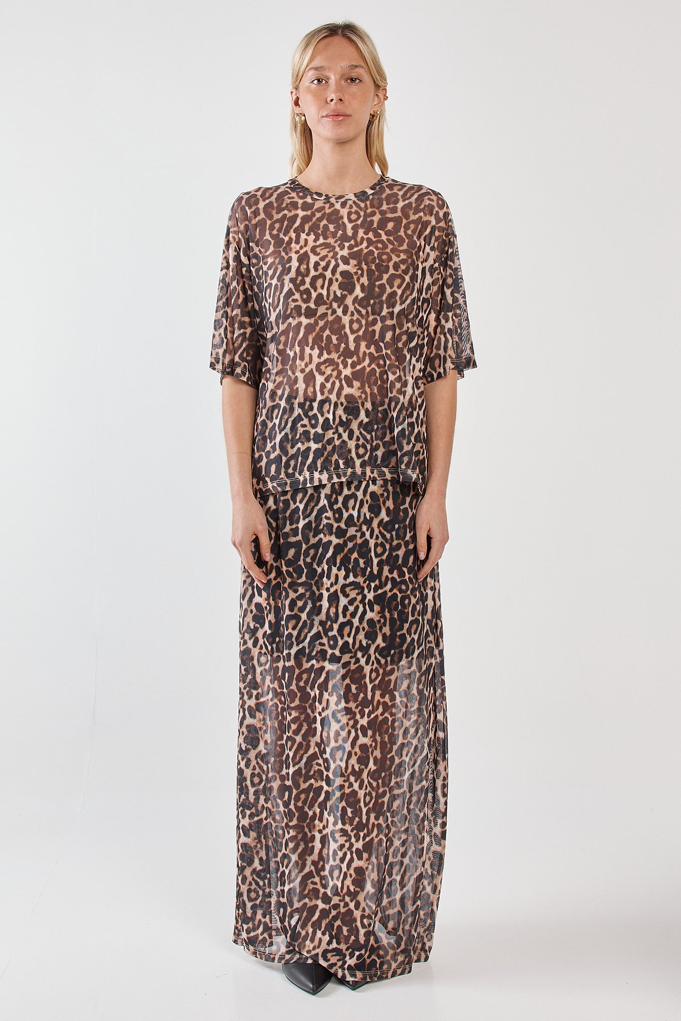 Image of a model wearing Skirts. Product name - Oxley Print Mesh Skirt Animal in Animal colour by brand - Sass Clothing