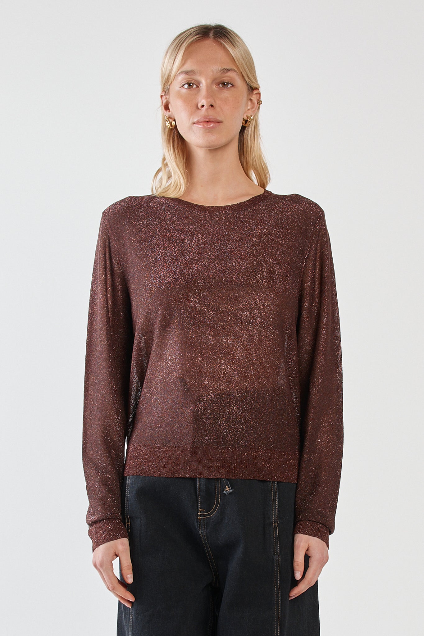 Image of a model wearing Outerwear. Product name - Maiken Lurex Knit Jumper Chocolate in Chocolate colour by brand - Sass Clothing