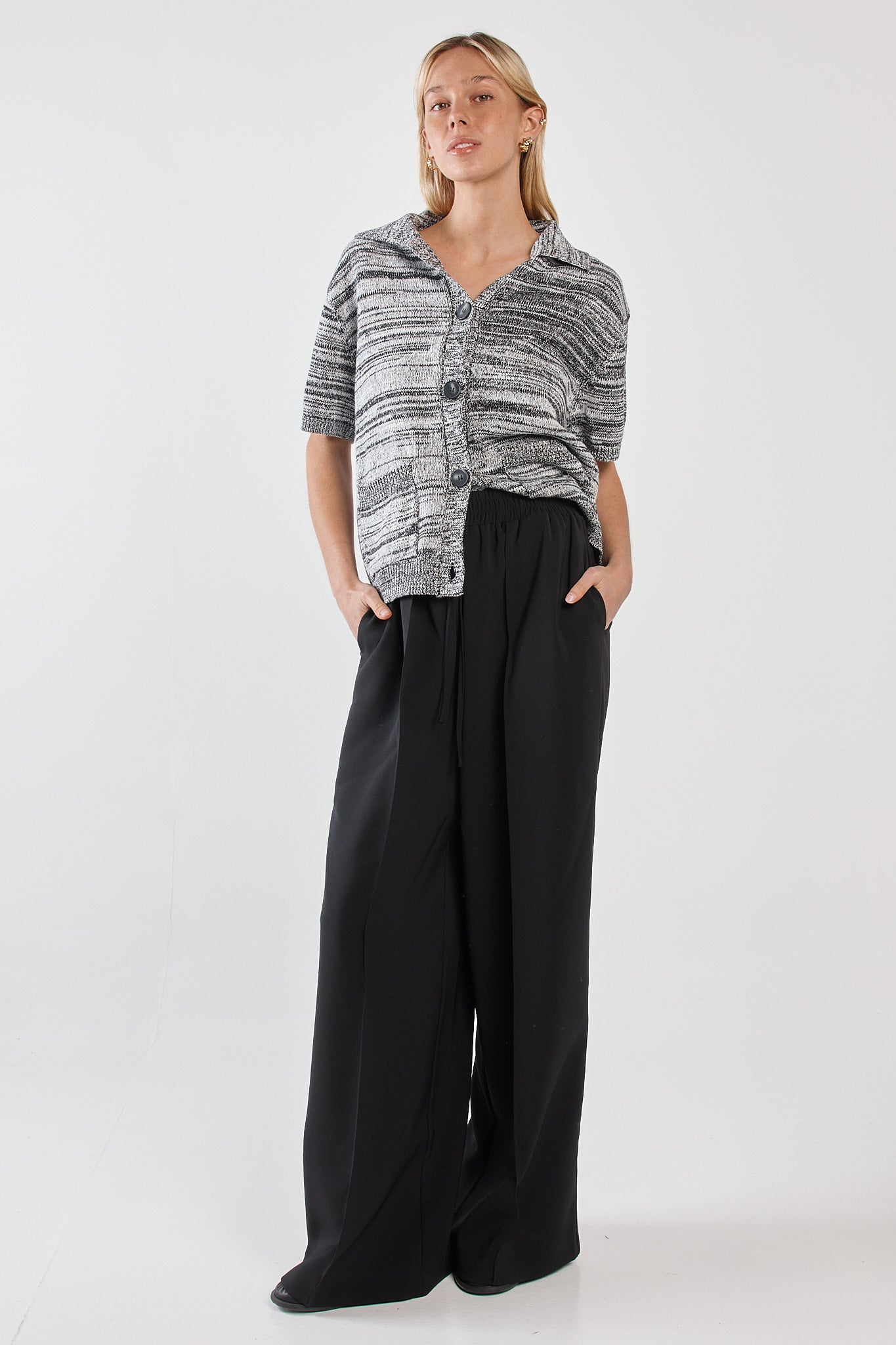 Image of a model wearing Pants. Product name - Rossi Casual Pant Black in Black colour by brand - Sass Clothing