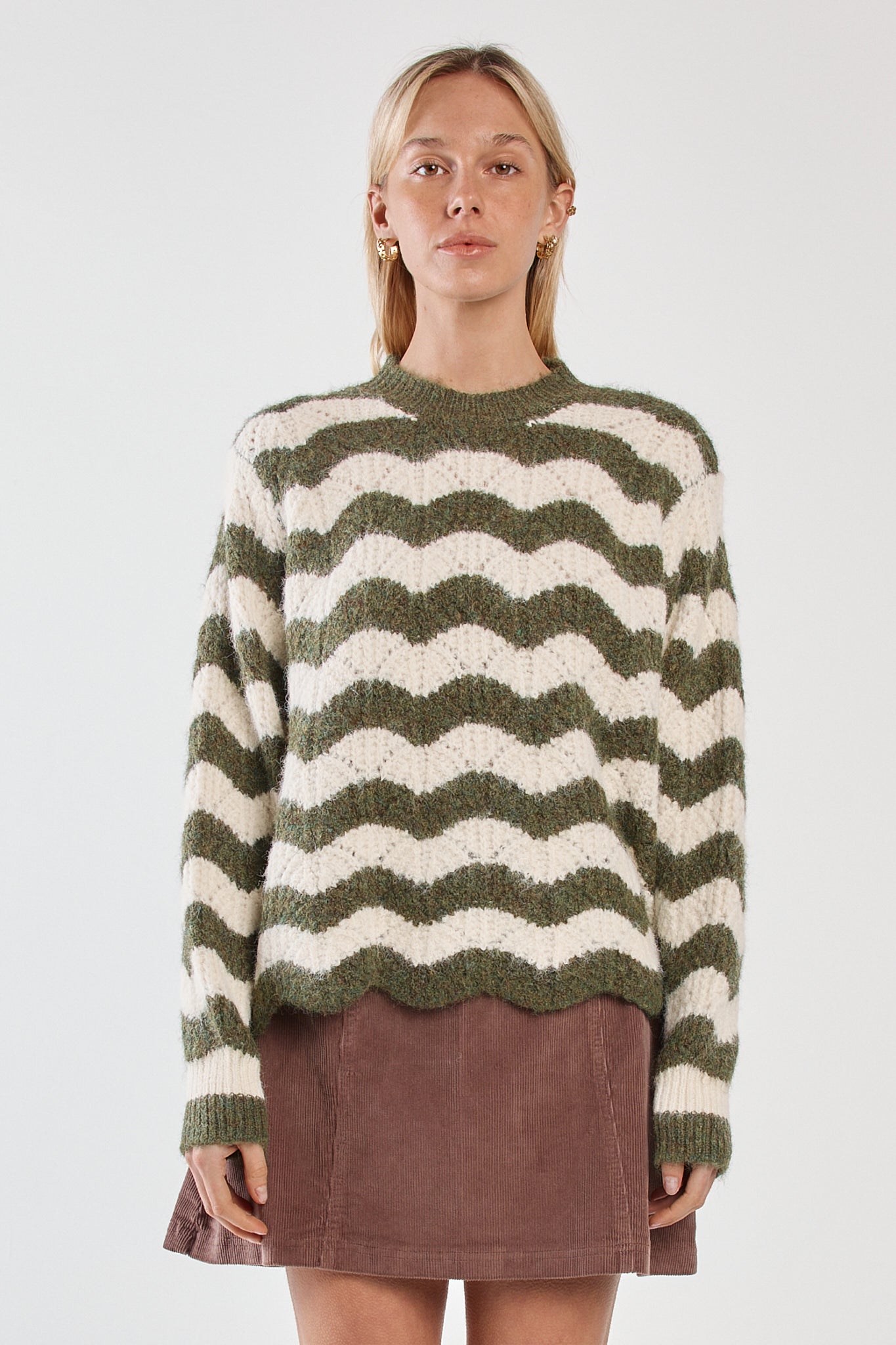 Image of a model wearing Outerwear. Product name - Nikkita Wavy Stripe Knit Cream/Olive in Cream/Olive colour by brand - Sass Clothing