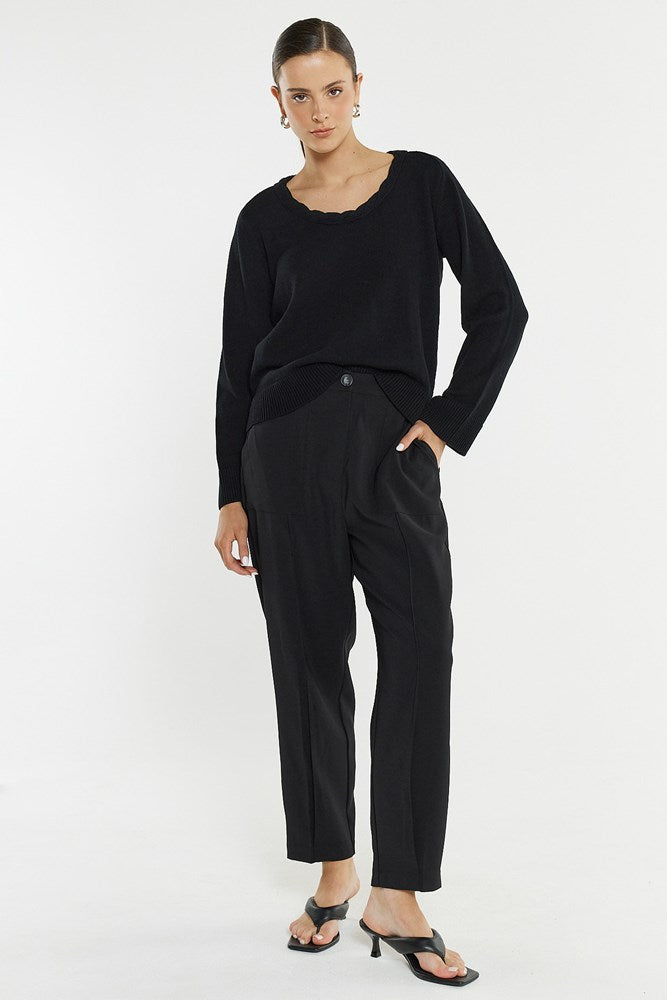 Image of a model wearing Pants. Product name - Lo Tapered Cargo in Black colour by brand - Sass Clothing