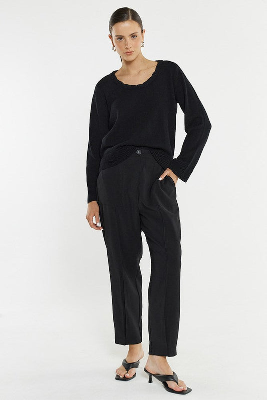 Image of a model wearing Pants. Product name - Lo Tapered Cargo in Black colour by brand - Sass Clothing