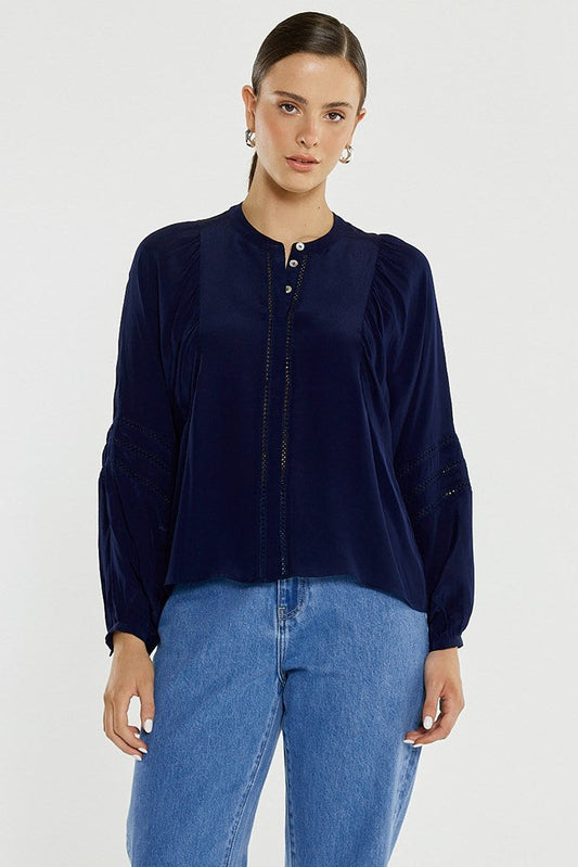 Image of a model wearing Tops. Product name - Nic Trim Blouse in Ink colour by brand - Sass Clothing