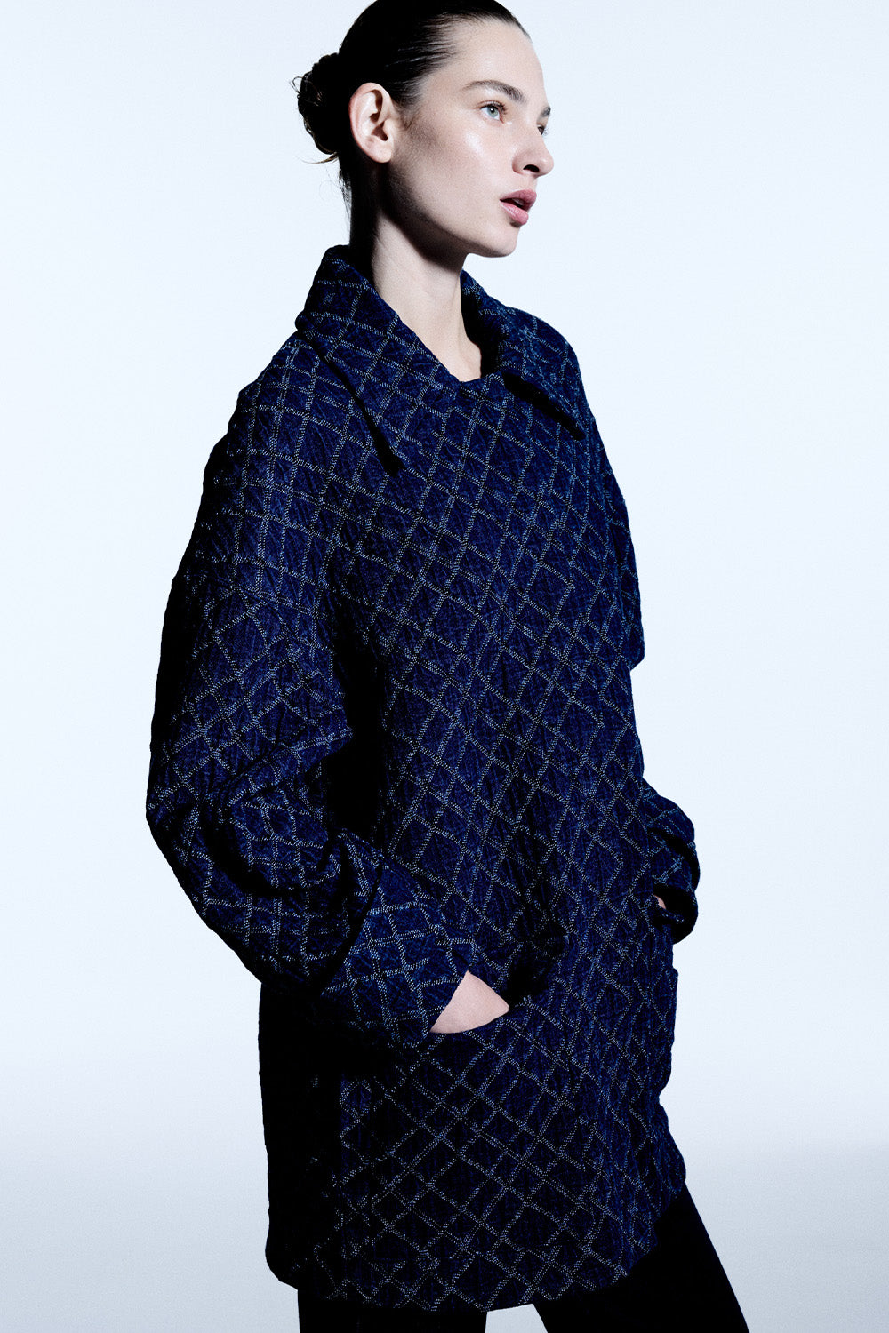 Image of a model wearing Outerwear. Productname: Quilted Denim Bomber in Blue colour by brand - Manning Cartell