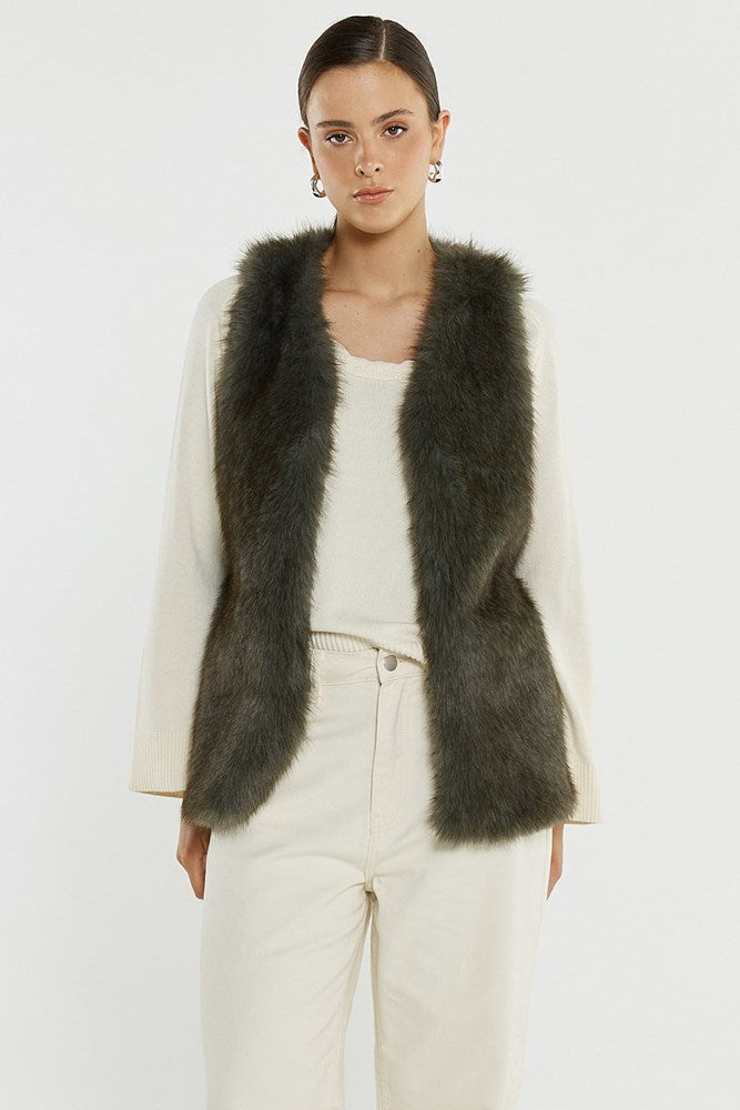 Image of a model wearing Outerwear. Product name - Riya Fur Gilet in Evergreen colour by brand - Sass Clothing