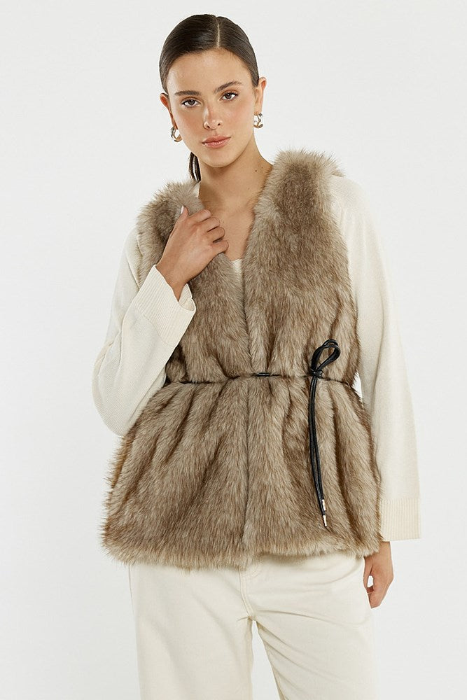 Image of a model wearing Outerwear. Product name - Riya Fur Gilet in Fawn colour by brand - Sass Clothing