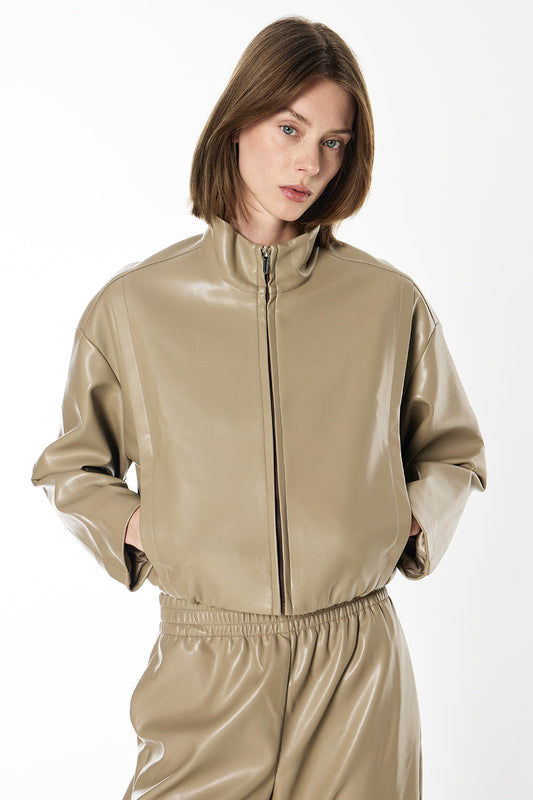 Image of a model wearing Outerwear. Productname: Major Players Cropped Bomber in Taupe colour by brand - Manning Cartell