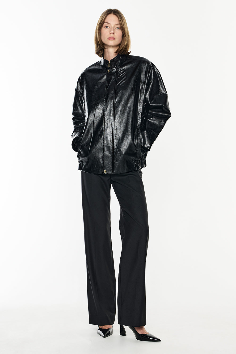 Image of a model wearing Outerwear. Productname: Love X Love Bomber in Black colour by brand - Manning Cartell
