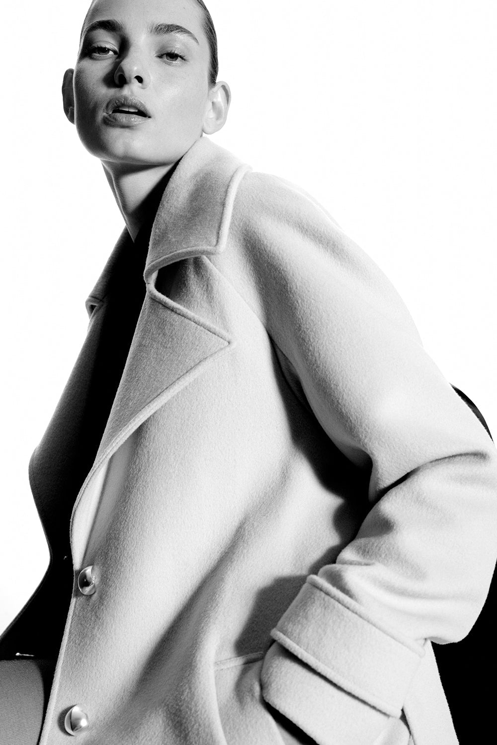 Image of a model wearing Outerwear. Productname: Parisian Lens Coat in Stone colour by brand - Manning Cartell