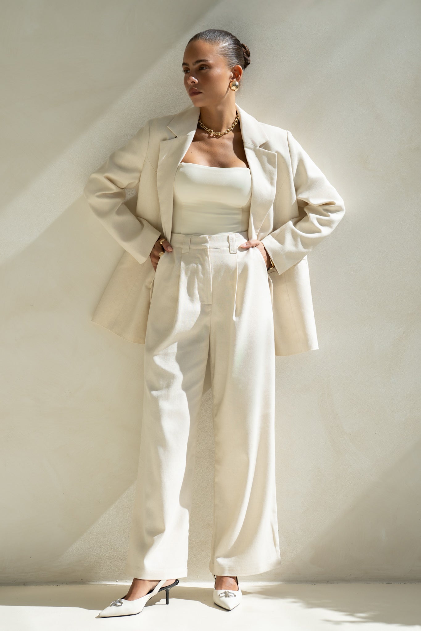 Image of a model wearing Shorts. Productname: Heychic Keke Beige Wide Leg Pants in Beige colour by brand - Heychic