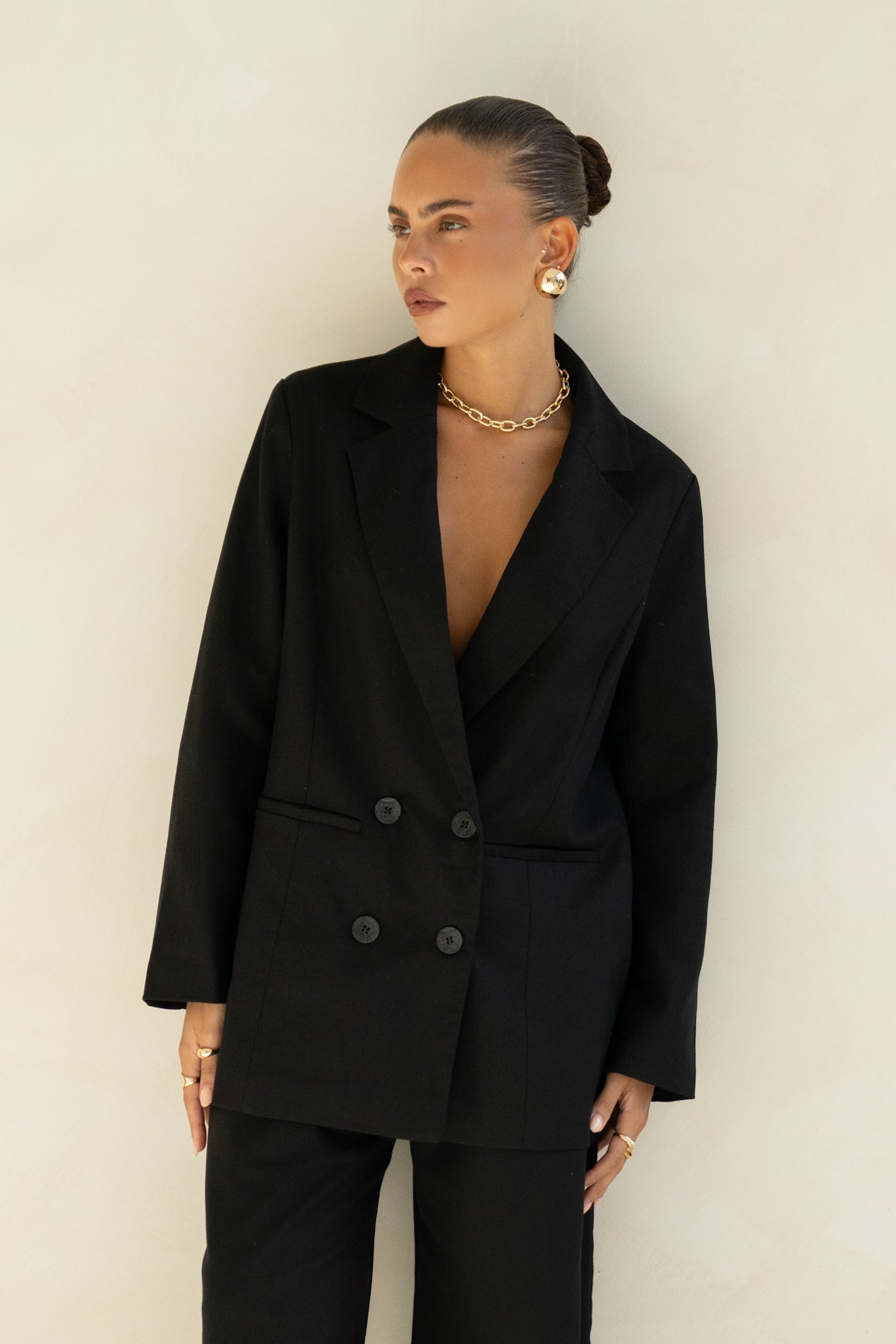 Image of a model wearing Tops. Productname: Heychic Keke Black Double Breasted Blazer in Black colour by brand - Heychic