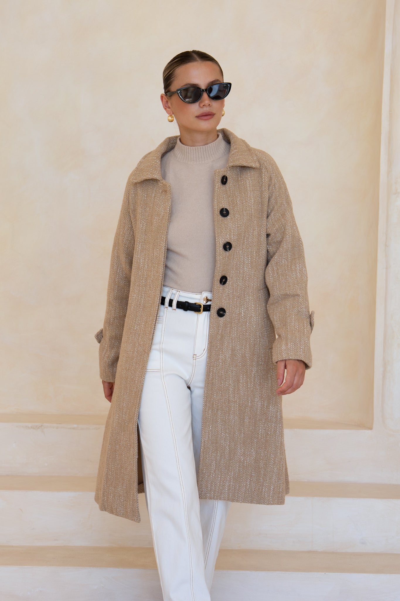 Image of a model wearing Tops. Product name - Katie Beige Coat in Beige colour by brand - HEYCHIC